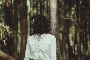 Enigmatic Woman Amidst the Forest