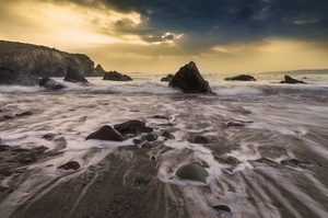 Foaming Waves by Rocks