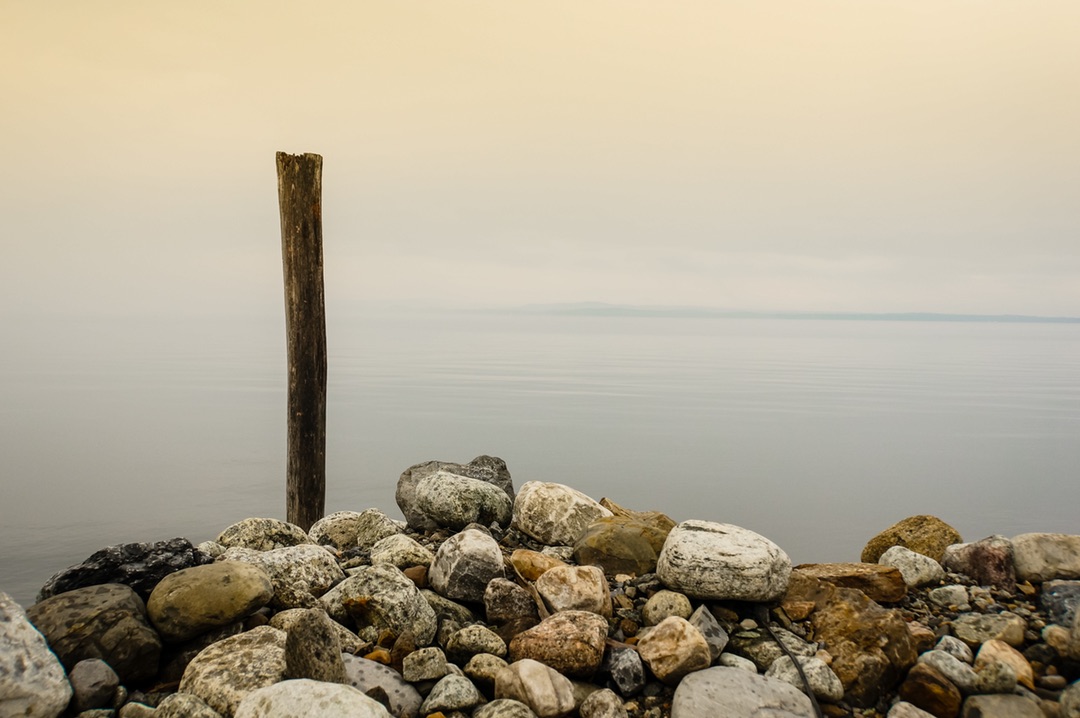 Solitary Post by the Ocean